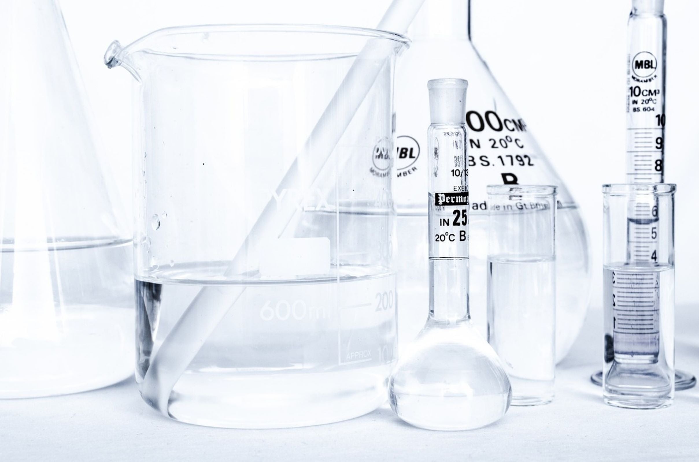 Laboratory glassware flasks containing water used for USP or EP test methods for supplements and pharmaceuticals 